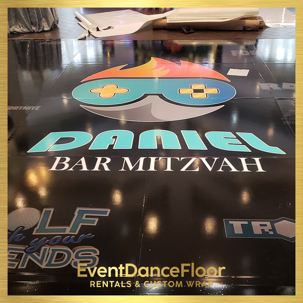 What types of props or decorations can be used to bring a Broadway vibe to a dance floor design?